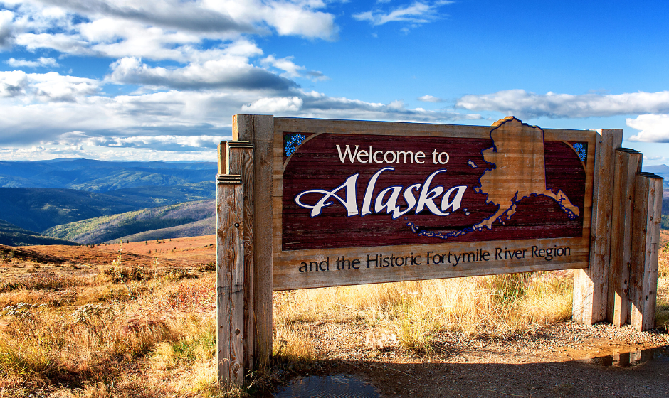 A welcome sign along a road in Alaska