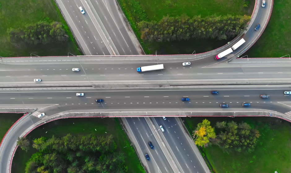 An overhead drone shot of a highway interchange