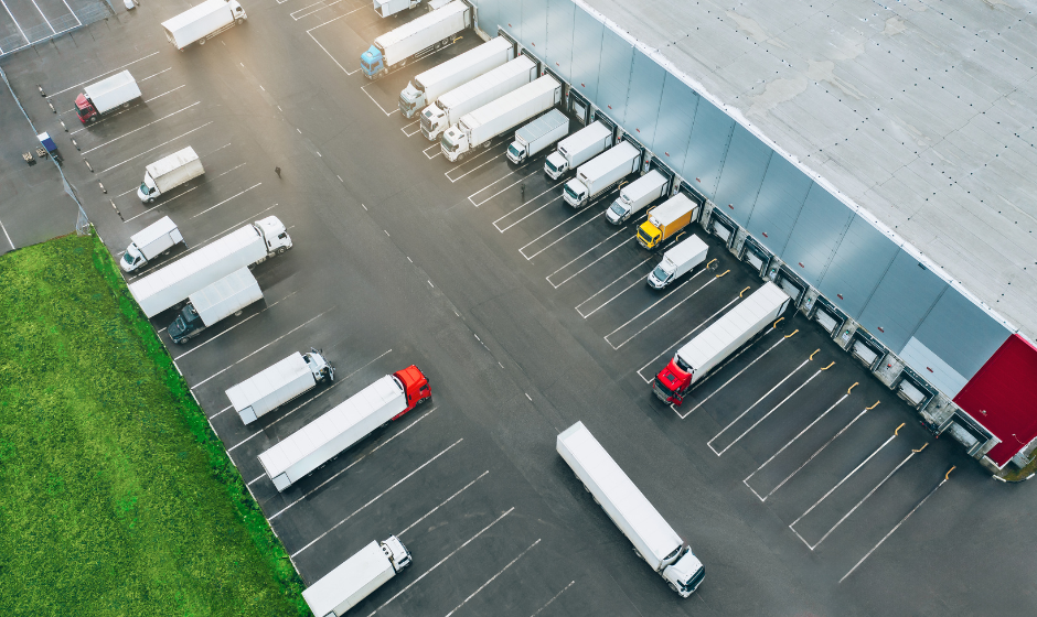 Several sizes of trucks at a distribution center