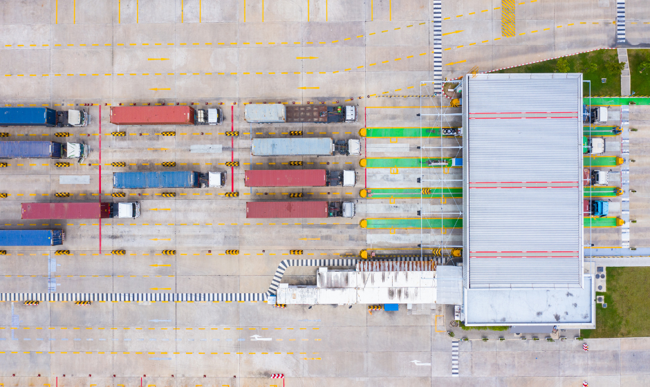 Semi trucks wait in queue to enter a port