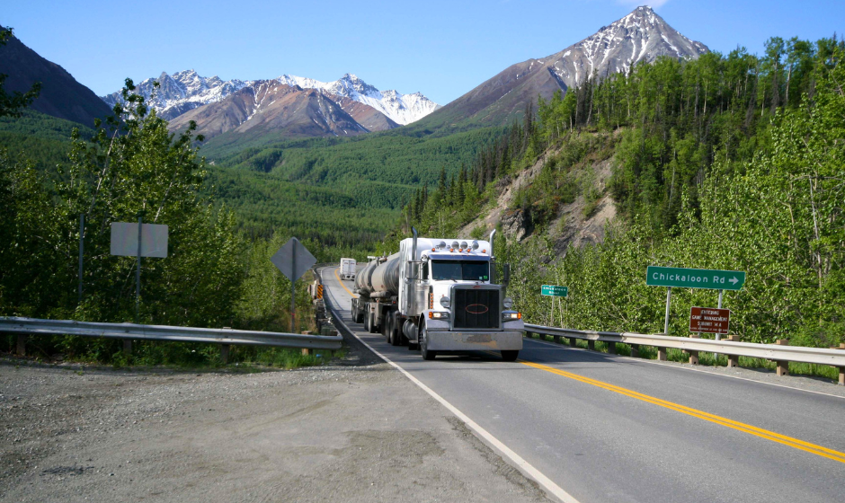 A flatbed passes Chickaloon River in Alaska