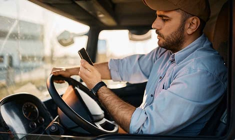 Truck driver analyzing rate confirmation