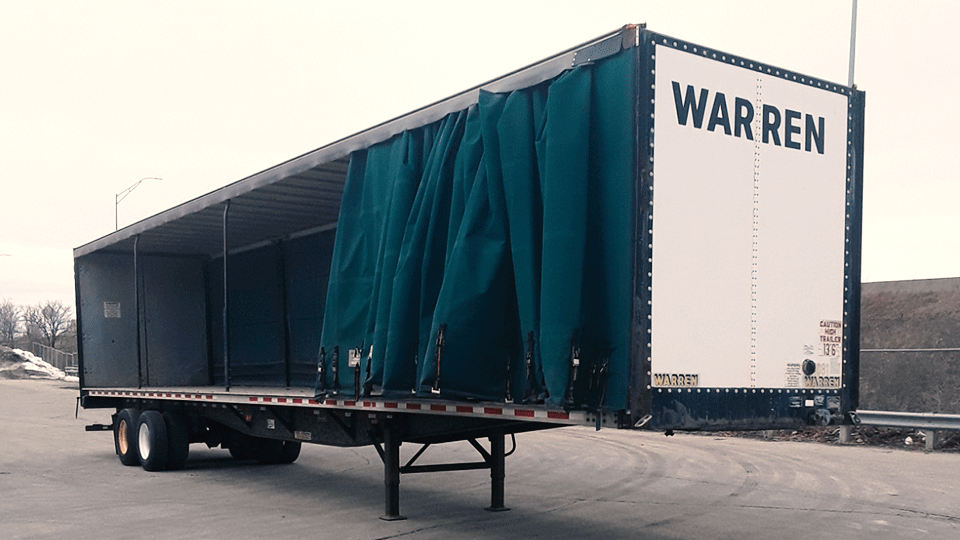 An empty curtainside trailer