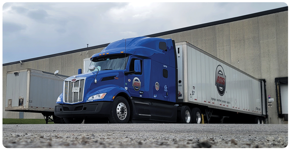 A semi truck with a dry van trailer